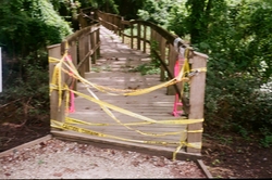 An entryway to a boardwalk, caution-taped off