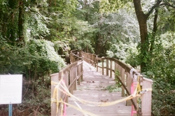 An entryway to a boardwalk, caution-taped off