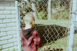 Nate looking through the fence (from the back)