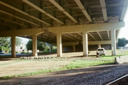 Train tracks under an overpass